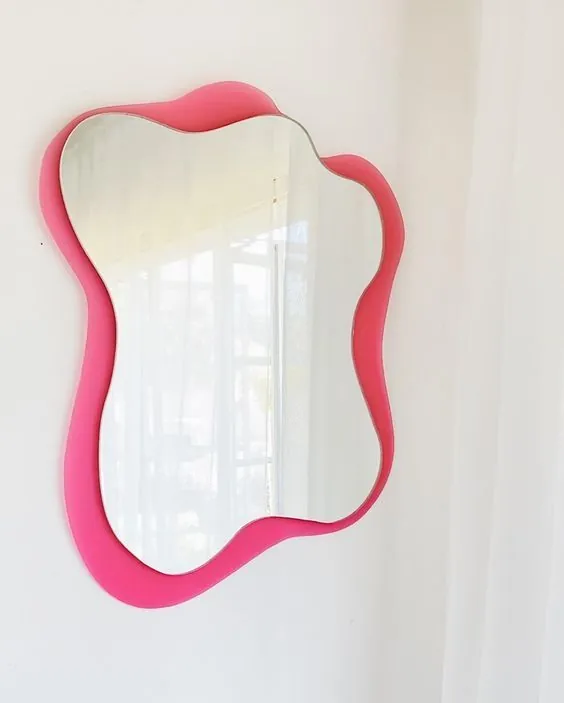 Pink Wavy Mirror: organic wavy-edged mirror in a hot-pink lacquer frame
